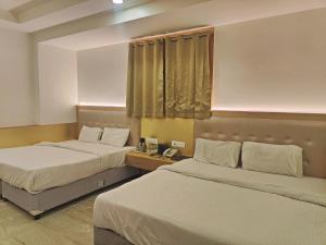 Postel nebo postele na pokoji v ubytování Hotel Nirmal Mahal - Paharganj - New Delhi