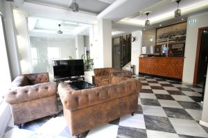 TV a/nebo společenská místnost v ubytování Mirabello Hotel