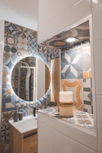 a bathroom with a sink and a mirror at Casa dos Avós - Folgosa Douro in Folgosa