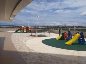 a playground with slides and play equipment in a building at Apartamento confortável, localização extra -recepção 24h- Varanda com vista panorâmica in Juazeiro do Norte