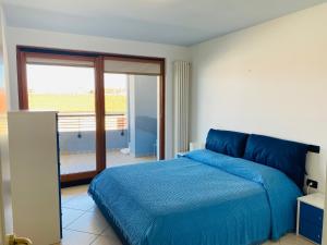 Katil atau katil-katil dalam bilik di Costa Azzurra Apartment