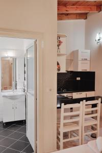 a kitchen with a table and two chairs in a room at Villa Matilda in Borsh +64 photos