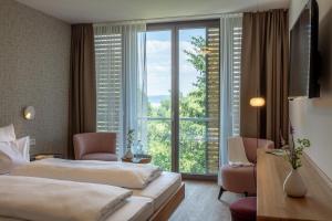 Postel nebo postele na pokoji v ubytování Seehörnle Bio Hotel & Gasthaus