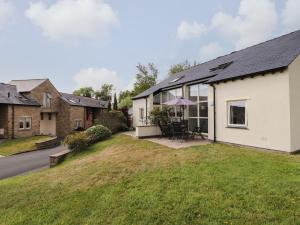 an exterior view of a house with a yard at Ash Meadows in Carnforth