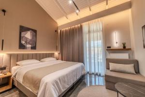 Postel nebo postele na pokoji v ubytování Agnantio Hotel & Spa + 37 fotografií