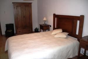Uma cama ou camas num quarto em Alojamento Rural Casa da Eira