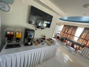 a room with a counter with a coffee machine on it at Hotel Diamond in Limenaria