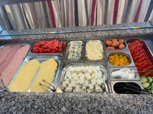 a buffet of different types of food on a counter at Hotel Diamond in Limenaria
