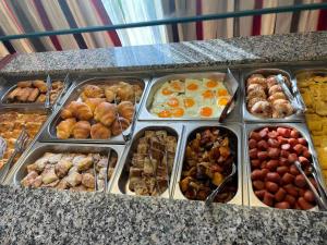 a buffet of different types of food on a counter at Hotel Diamond in Limenaria