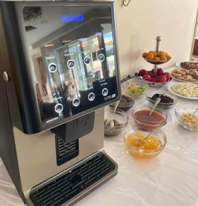 a coffee machine sitting on top of a table at Hotel Diamond in Limenaria