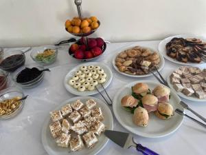 a table with many plates of food on it at Hotel Diamond in Limenaria