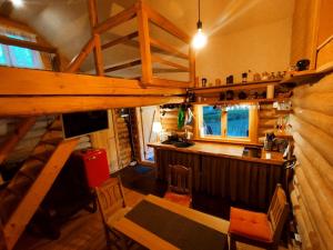 an overhead view of a kitchen and a bar in a cabin at Namiņš Guntas in Uguņi