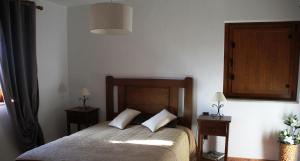 Uma cama ou camas num quarto em Alojamento Rural Casa da Eira