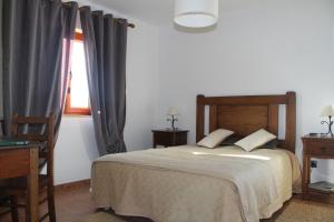 Uma cama ou camas num quarto em Alojamento Rural Casa da Eira