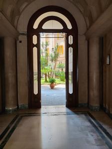 an open door in a building with a hallway at The House Of The Sunbeam in Naples