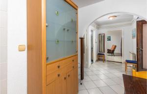 a bathroom with a sink and a glass cabinet at Beautiful Apartment In Ika With Wifi in Ika