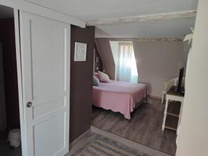 Postel nebo postele na pokoji v ubytování Demeure d'antan