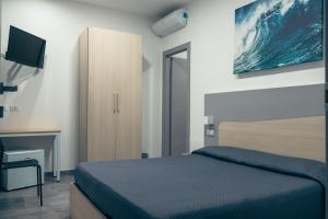 Posteľ alebo postele v izbe v ubytovaní BluMarine Appartaments