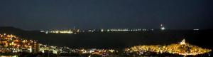 a view of a city at night with lights at Tarnovo Studios City Center in Veliko Tŭrnovo