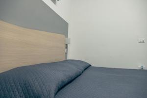 Posteľ alebo postele v izbe v ubytovaní BluMarine Appartaments