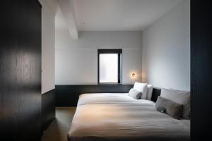 Postel nebo postele na pokoji v ubytování DDD HOTEL