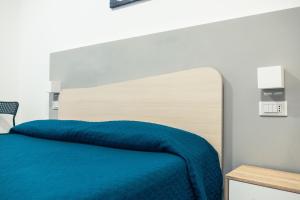 Posteľ alebo postele v izbe v ubytovaní BluMarine Appartaments