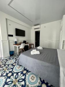 Cama ou camas em um quarto em TEA Luxury - Praia a Mare