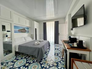 Cama ou camas em um quarto em TEA Luxury - Praia a Mare