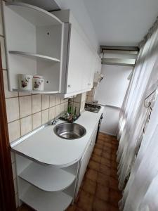 a small kitchen with a sink and a counter at la maison du centre in Irún