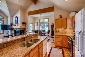 a kitchen with a sink and a counter top at Beautiful Mountain Townhome with Private Hot Tub, Steps from Everything Breckenridge! HL305 in Breckenridge