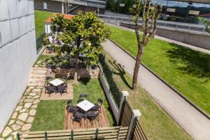 A garden outside Nova Compostela Apartments