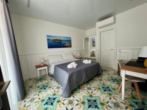 Cama ou camas em um quarto em TEA Luxury - Praia a Mare