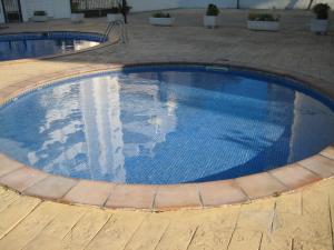 Der Swimmingpool an oder in der Nähe von Ada Neptuno Apartamento, Aire acondicionado, WiFi, Piscinas, Parking
