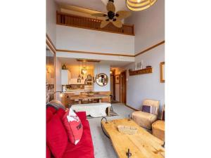 a living room with a couch and a table at Glacier Lodge Steps to Trails and Nature in Whistler +8 photos