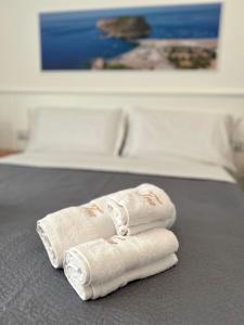 Cama ou camas em um quarto em TEA Luxury - Praia a Mare