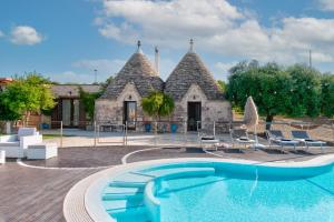 The swimming pool at or close to Trulli Ericla Luxury