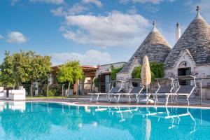 The swimming pool at or close to Trulli Ericla Luxury
