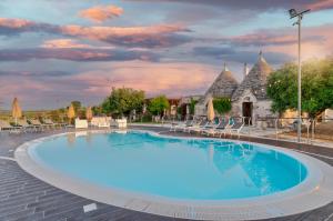 The swimming pool at or close to Trulli Ericla Luxury