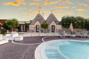 The swimming pool at or close to Trulli Ericla Luxury