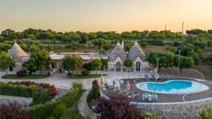 The swimming pool at or close to Trulli Ericla Luxury