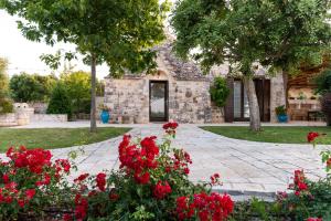 A garden outside Trulli Ericla Luxury