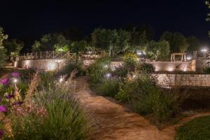 A garden outside Trulli Ericla Luxury