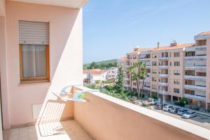 a balcony with a view of a city at Budget Beds in Alghero