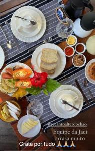 a table with plates of food on top of it at Recanto Alter do Chão in Alter do Chao