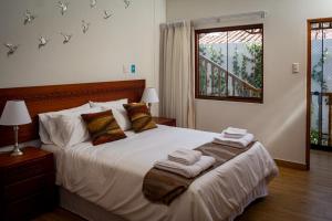 a bedroom with a bed with towels on it at Inkantari Boutique Hotel in Cusco