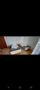 two beds sitting on the floor in a room at Jasna 2 in Stari Grad