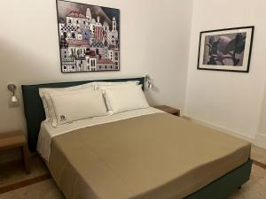 Postel nebo postele na pokoji v ubytování VIANNA SUITES SPA + 37 fotografií