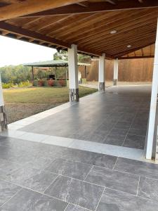 an empty patio with a wooden roof and columns at Hermosa vista GH #4 in Guarne
