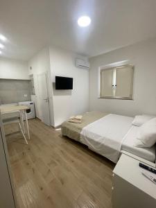 Posteľ alebo postele v izbe v ubytovaní GM IMMOBILIARE