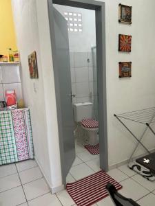 a bathroom with a toilet and a shower in it at Betesda in São Luís +50 photos